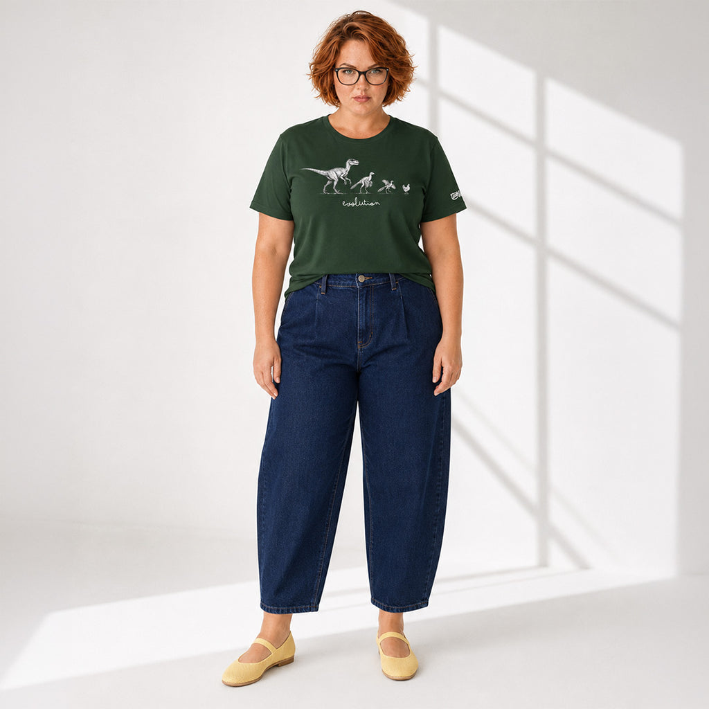 Person wearing a green t-shirt with a graphic design and blue jeans on a white background