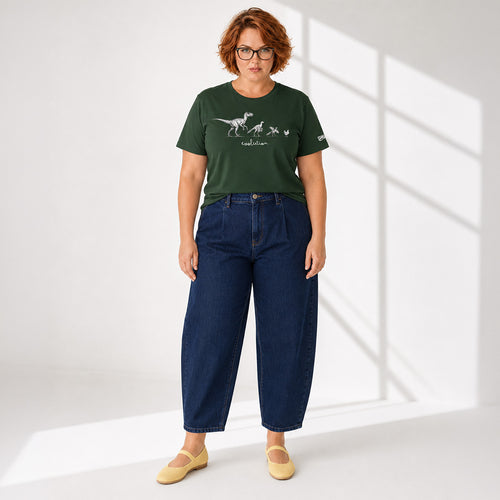 Person wearing a green t-shirt with a graphic design and blue jeans on a white background