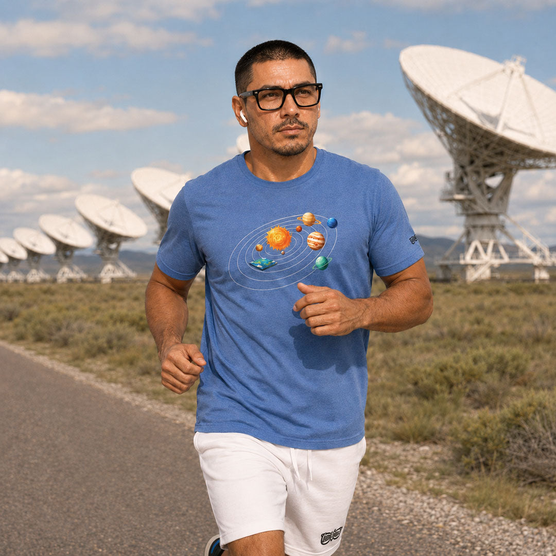 Man running on a road with satellite dishes in the background