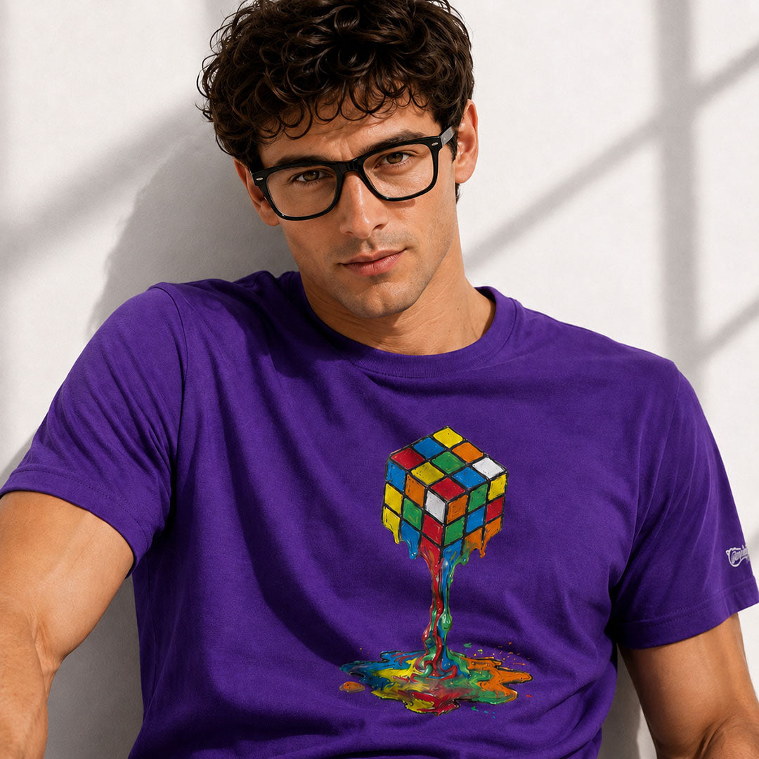 Man wearing a purple t-shirt with a colorful Rubik's Cube design against a white background