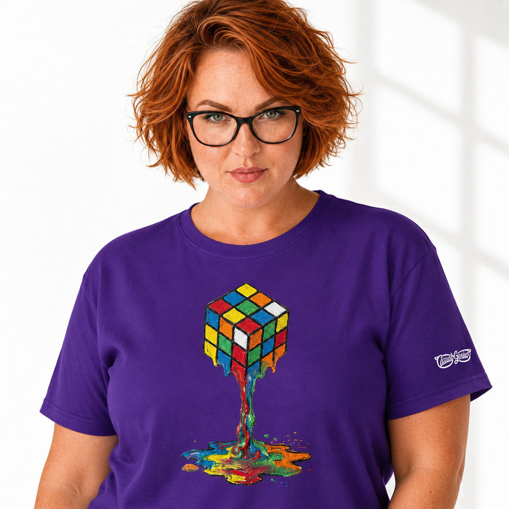 Person wearing a purple t-shirt with a colorful cube design on a white background