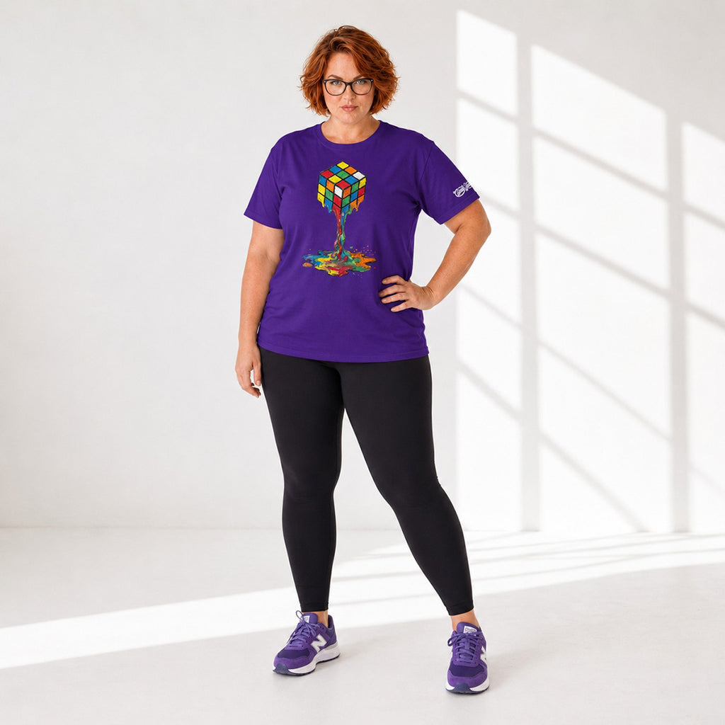 Person wearing a purple t-shirt with a colorful design, black leggings, and purple shoes in a bright room.
